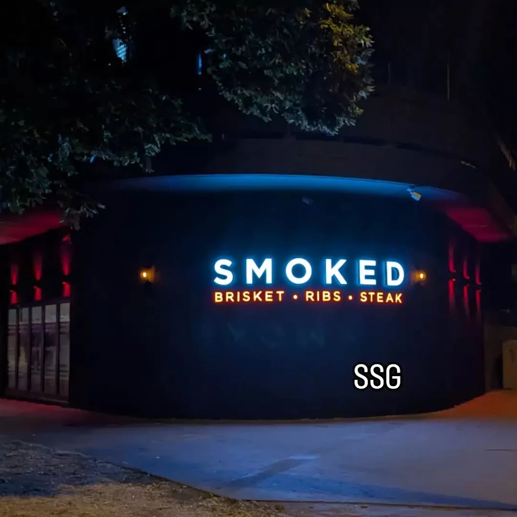 Smoked — brisket, ribs, steak — Koma Chophouse signage